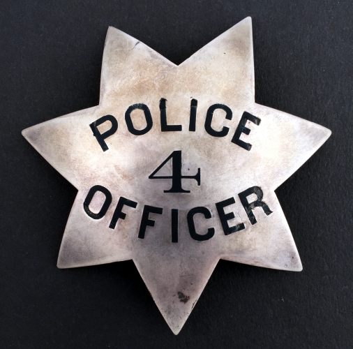 Oakland Police 1st issue badge #4 issued to Officer Adelbert Wilson, circa 1870. His 14k gold Captain badge is shown below.