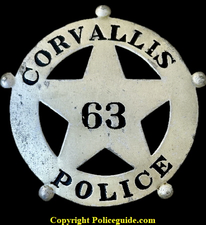 Corvallis Police badge No. 63. Corvallis Police badge No. 63.