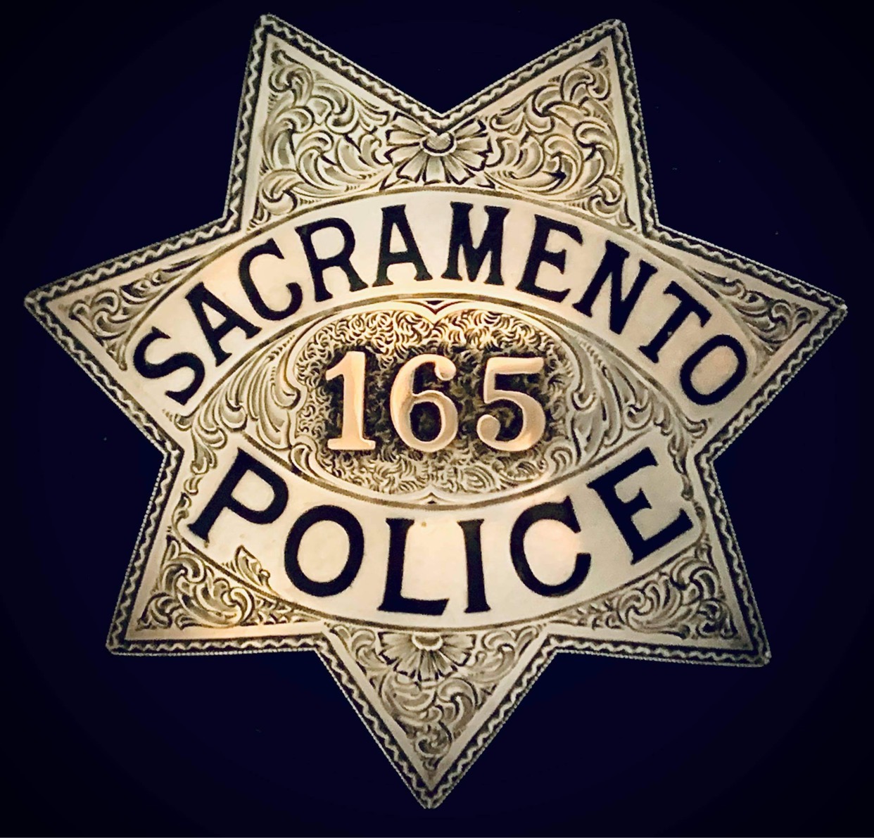 Engraved sterling silver Sacramento, CA police badge #165.