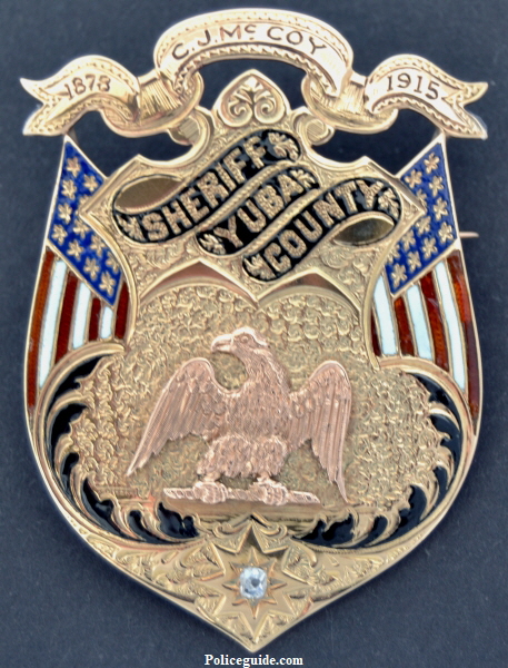 14k gold badge worn by Hank McCoy who was elected in 1878. His son Charles J.McCoy followed in his footsteps and was elected Sheriff in 1914, a position he held for 32 years until 1946. Charles had a jeweler add the top ribbon and proudly wore the badge. This badge is pictured in Witherells book, Californias Best? on page 25.