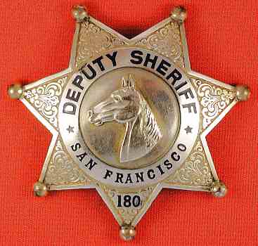 Gold front San Francisco Deputy Sheriff badge.