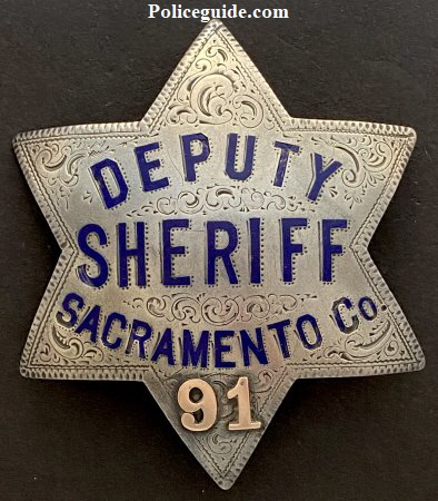 Sacramento County Deputy Sheriff badge #91. Made of sterling silver, hand engraved, hard fired blue enamel with applied gold numbers.