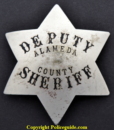  Alameda Co. Deputy Sheriff badge.  Reverse marked Ed Jones Ger. Silver and 853  40th St. Oakland, CAL.  This was his mothers residence and he used the garage as his shop.  SKU1250