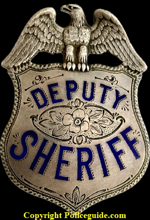 Alameda Co. Deputy Sheriff eagle top shield, Presented to Jack Banchio by Frank Barnet Sheriff 1923.  Sterling silver with hard fired blue enamel  SKU4545