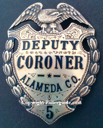 Alameda Co. Deputy Coroner #5, sterling silver, hard fired black enamel and hand engraved.  Made by Ed Jones Co. Oakland, CAL
