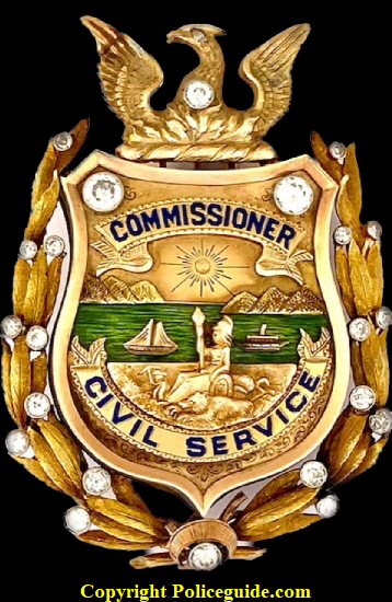 14k & 18k gold Civil Service Commissioner badge with beautiful green enamel representing the San Francisco Bay and adorned with 22 diamonds.  The badge was presented to Thomas Carney in 1927.