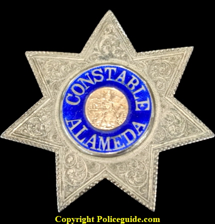 Constable Alameda (City of) sterling silver star with reverse blue enamel lettering and a karat gold center seal.