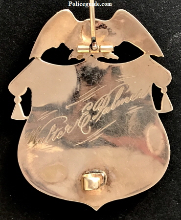 1k gold Baker Oregon Chief of Police badge presented to Walter E. Palmer.