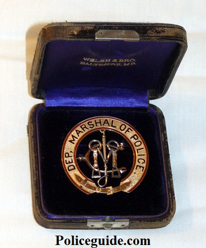 Badge in original jewelers box.