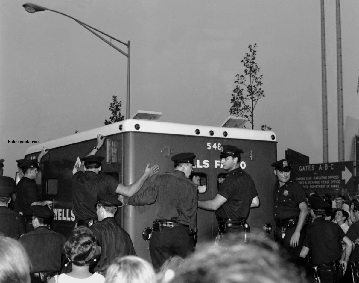 Wells Fargo Truck with New York's Finest  surrounding it.