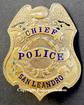 Presentation on reverse reads To J. F. Peralta From Jack Cribbins.  This badge is thought to have been Chief Peralta’s first Chief of Police badge.  After the badge to the right was presented to him this badge was used as a hat badge.