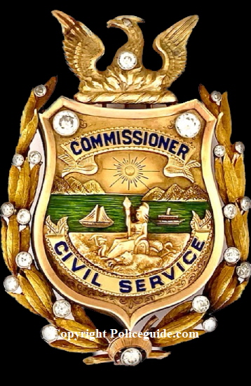 14k & 18k gold Civil Service Commissioner badge with beautiful green enamel representing the San Francisco Bay and adorned with 22 diamonds.  The badge was presented to Thomas Carney in 1927.