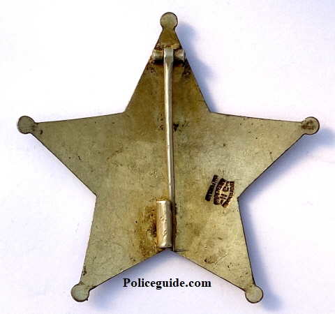 Obverse of U. S. Deputy Marshal badge from Hawaii, circa 1902.  Hallmarked:  Made in Honolulu HC sterling.  T-pin and Tube catch.