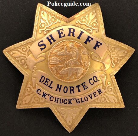 Gold front presentation badge to Del Norte Sheriff Glover.