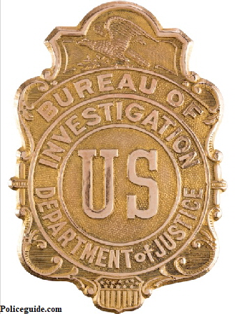 Bureau of Investigation US Department of Justice shield.   It appears to be gold-plated brass and is stamped on the back "Whitehead & Hoag Newark, N.J. Gold Filled" and "553". An eagle appears at top and a shield at the bottom. The background is stippled. Superb detail throughout. It has a C-type pin attachment on the verso. This type of badge saw use between 1908 and 1927. The Bureau of Investigation later became the Federal Bureau of Investigation (F.B.I.) beginning in 1935.