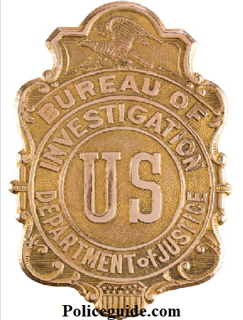 Bureau of Investigation US Department of Justice shield.   It appears to be gold-plated brass and is stamped on the back "Whitehead & Hoag Newark, N.J. Gold Filled" and "553". An eagle appears at top and a shield at the bottom. The background is stippled. Superb detail throughout. It has a C-type pin attachment on the verso. This type of badge saw use between 1908 and 1927. The Bureau of Investigation later became the Federal Bureau of Investigation (F.B.I.) beginning in 1935.