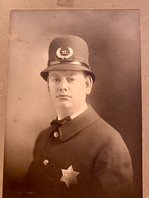 Fresno Police Officer wearing badge #11.