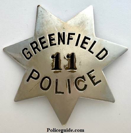 Greenfield Police Ddpartment badge # 11