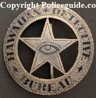Hawaiian Detective Bureau.� Sterling silver with hard fired black enamel.