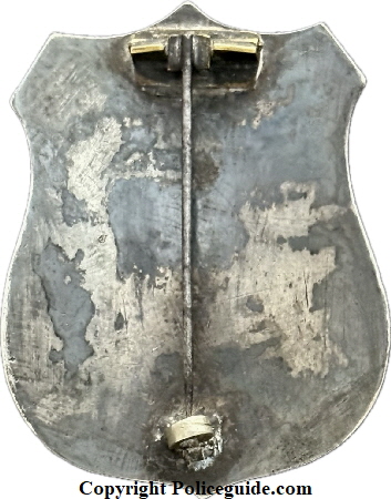 City Marshal Eureka shield, sterling silver, hand engraved, hard fired black enamel lettering.  The first City Marshal for Eureka was appointed in 1858.  On June 9, 1887 Ordinance 110 specifically designated the City Marshal as the ex-officio police chief.  In 1895 the title �City Marshal� was eliminated and the position of �Chief of Police� was created.