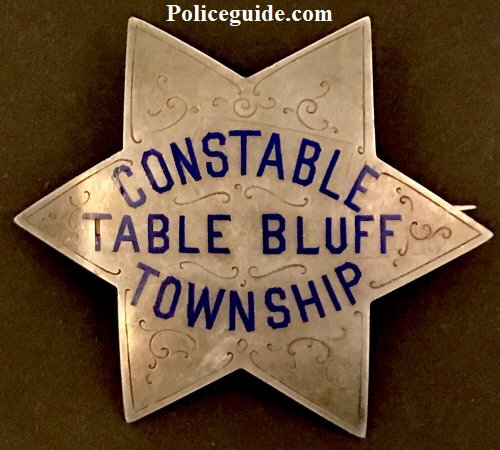 Constable Table Bluff Township (Loleta) is made of sterling silver with hard fired blue enamel and hand engraved.  Circa 1910.