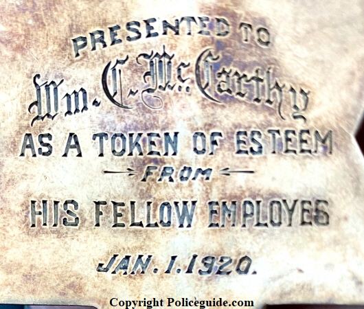 Back of gold badge reads:  Presented to Wm. C. McCarthy As A Token Of Esteem From His Fellow Employes Jan. 1, 1920.