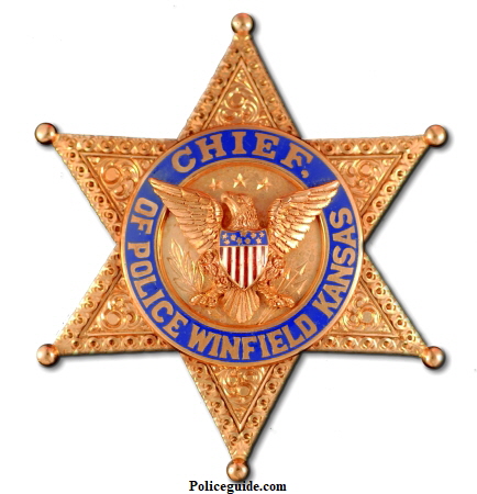 Fred C. Hoover was Chief of Police in Winfield from 1923-1931.  He began his lawman career in 1914 working as a Deputy Sheriff  for his father, L. W. Hoover, who was the elected Sheriff of Cowley County Kansas from 1912-1916.  From 1917-1918 Fred followed in his fathers footsteps and was the Undersheriff.  His Chief’s badge is 14k gold.