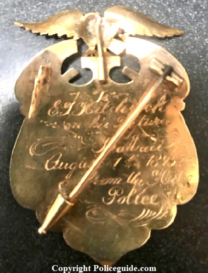 Back of 14k gold Sheriff badge:  To E. G. Hitchcock on his Return August 1, 1895 from the Hilo Police.