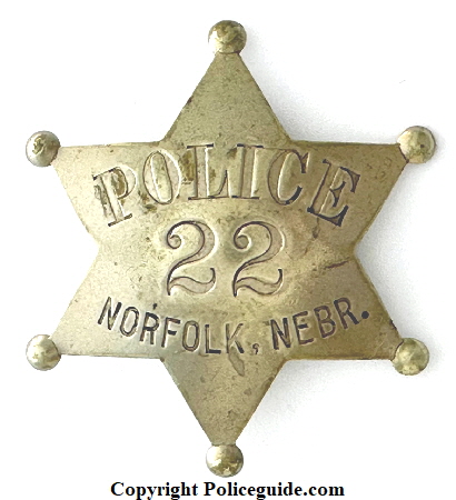 Norfolk Nebraska Police badge No. 22 made by J. P. Cooke Co. Mfgs Omaha, NEB.