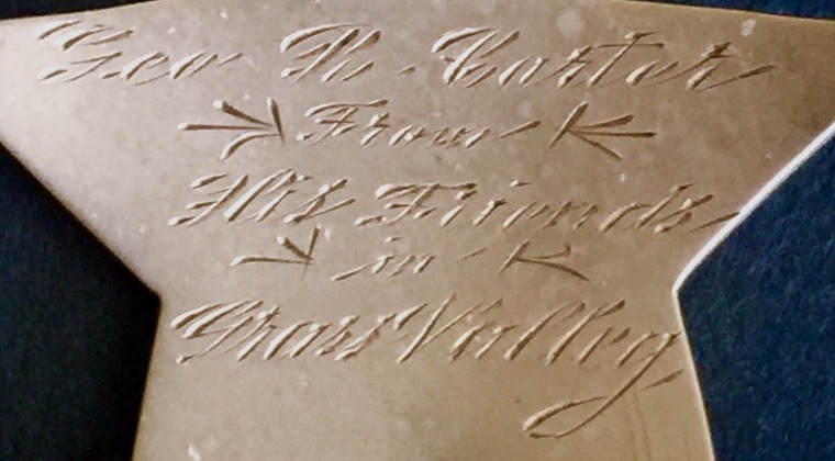 Presentation on reverse of George Carter�s 14k gold Sheriff badge.  To Geo R. Carter From His Friends in Grass Valley.