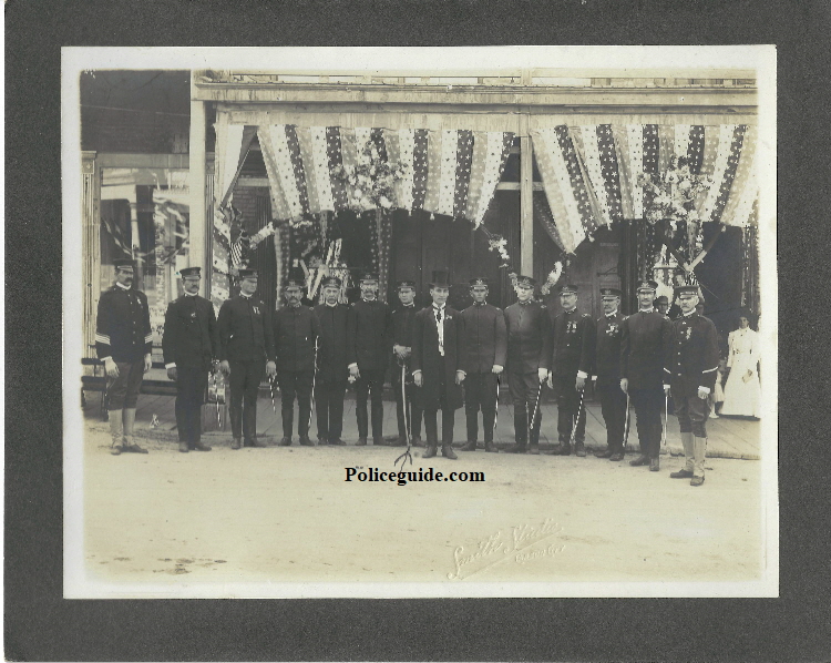 National Guard members, Bert Lundy is standing to the left of the gentleman in the top hat.  Photo by Smith Studio Carson City.