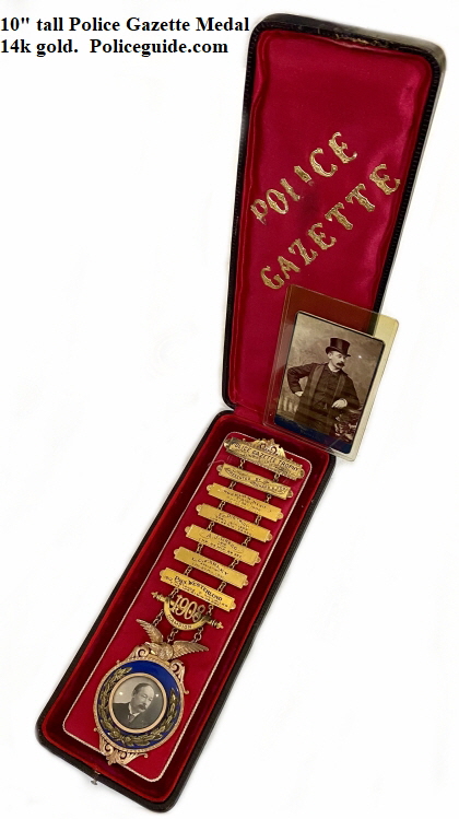 This Police Gazette Medal stands 10 tall and is 14k gold.