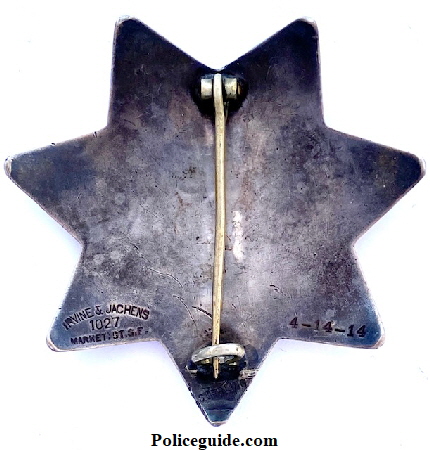 Back of SFPD star 85 made by Irvine & Jachens 1027 Market St. S.F. and dated 4-14-14 and issued to James W. Ray who was appointed April 13, 1914..