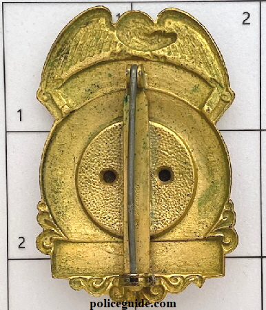 Back of Naval Intelligence badge issued to John J. Skelling in Brooklyn, N. Y