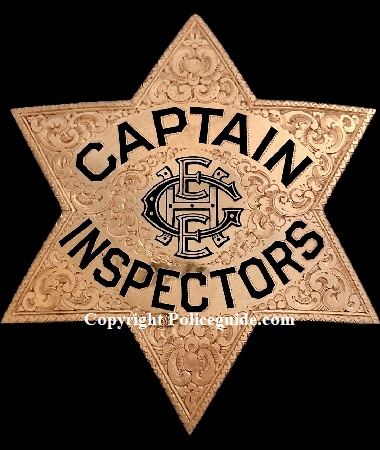 14k gold presentation Captain of Inspectors badge with monogramed initials in the center H E E G