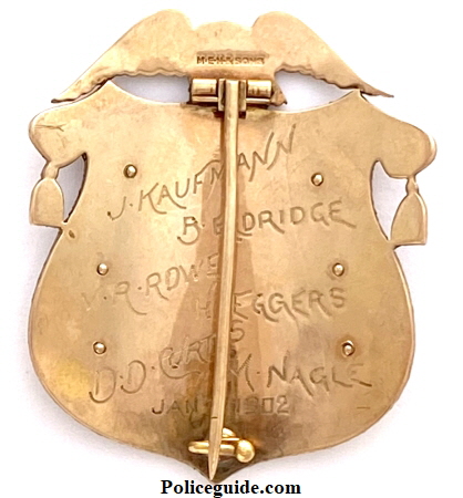 Scott Co Iowa Sheriff badge in 14k named to E. G. Mc Arthur.  Hallmarked Men & Sons.