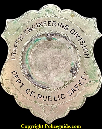 Caleb J. Brinton’s Traffic Engineering Division Dept. of Public Safety issue shield.  Missing the center seal.