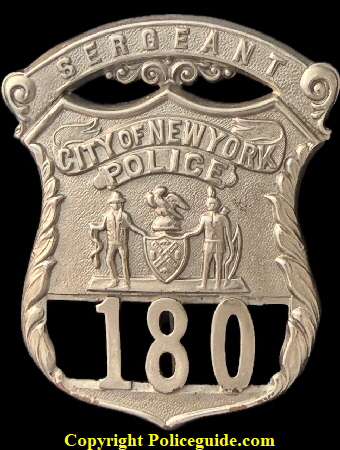 1903 issue of the NYPD Sergeant shield referred to as the Type 1, later changed to a gold color shield known as the Type 2.