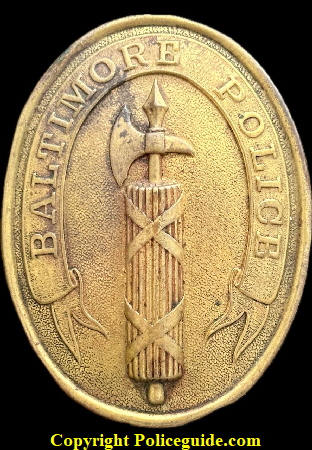 Baltimore Police 2nd issue shield used from 1860 to 1862.  The Baltimore Police really got into the Roman shield on this extra large badge.  In the center is the Roman Fasces, an ax surrounded by a bundle of rods.  It shybolized the power and jurisdiction of law enforcement on the Baltimore badge and the Roman King's power to punish his subjects in ancient Rome.