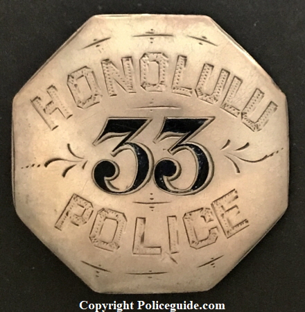 Honolulu Police badge #33, sterling with hard fired black enamel and hand engraved.
