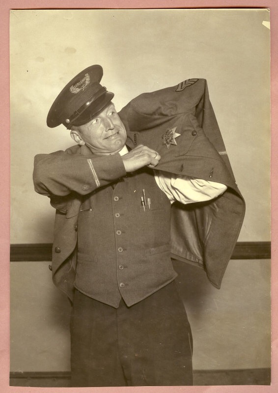 Sergeant O.G. Engdol Oakland Police Department.  Wearing badge #198.