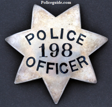 Circa 1915 Oakland Police badge #198 issued to O.G. Engdol.  Below is a photo of Engdol wearing his Sergeant badge.