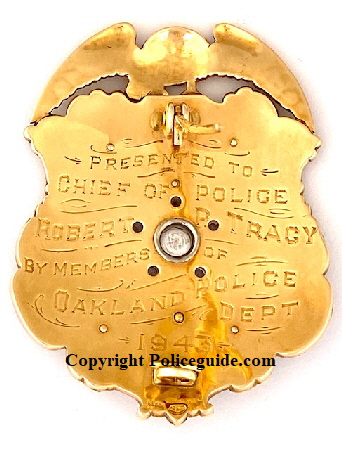 Back of badge showing presentation and hallmark.  “ Presented to Chief of Police Robert P. Tracy by members of Oakland Police Dept. 1943.  Made by Block Jewelery Oakland, CAL.  14k gold in 1943.