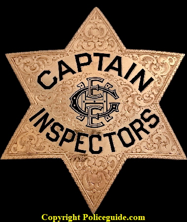 14k gold presentation Captain of Inspectors badge with monogramed initials in the center H E E G