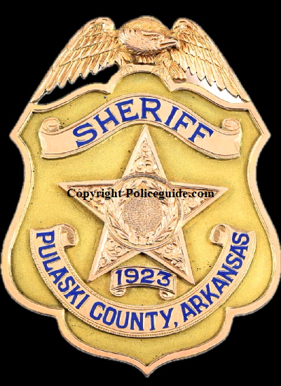 14k gold Sheriff Pulaski County, Arkansas 1923 eagle top shield.  Presented to Homer M. Adkins who was Sheriff from 1923 to 1926.  He later became Governor of Arkansas.