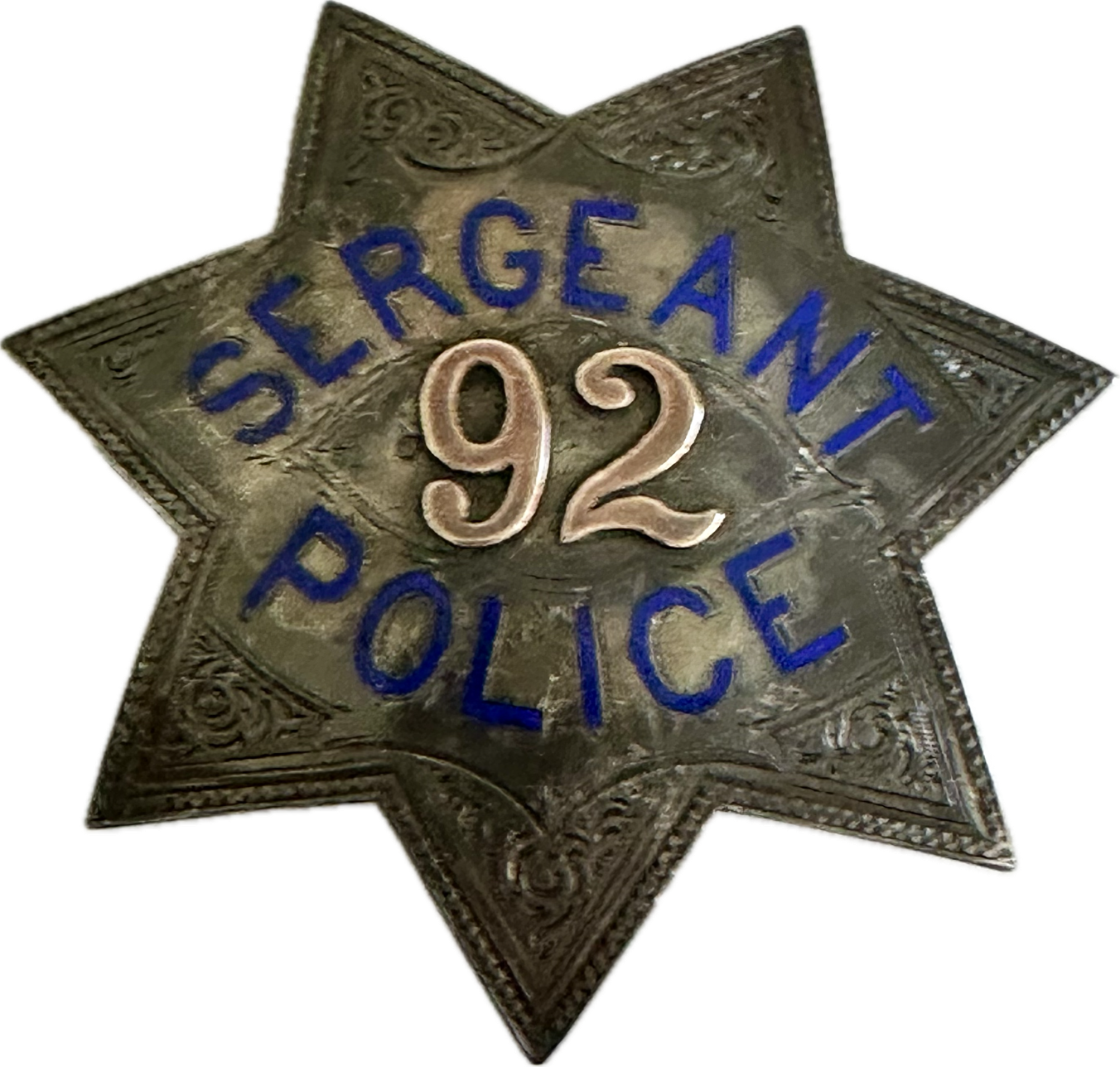 San Francisco Police Sergeant star No. 92 issued to Charles H. McDonald who was appointed a Patrolman on April 14, 1878 and promoted to Sergeant December 1895.  The star is 3 5/16” tall. Sterling silver with hard fired blue enamel lettering and 14k applied gold numbers.