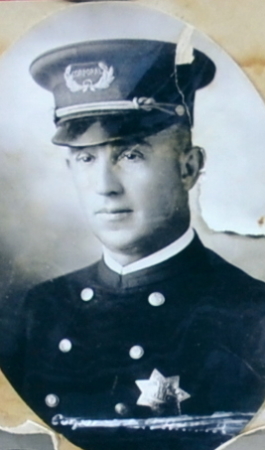 Corporal Lee Parker wearing sterling silver badge #10, Circa 1924. 