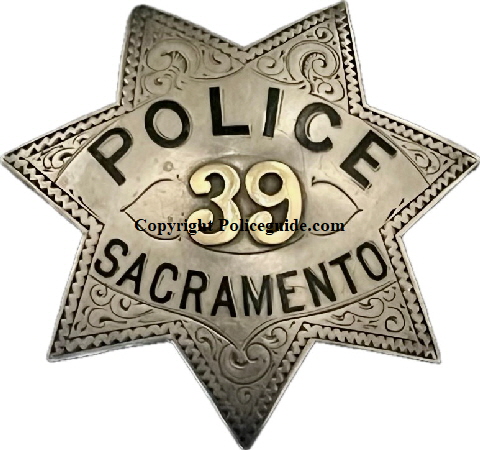 Sacramento Police badge #39, sterling silver with 14k gold applied numbers and hard fired enamel lettering.  On the back of the badge is the name T. W. Pearson and the date June 10, 1913.
