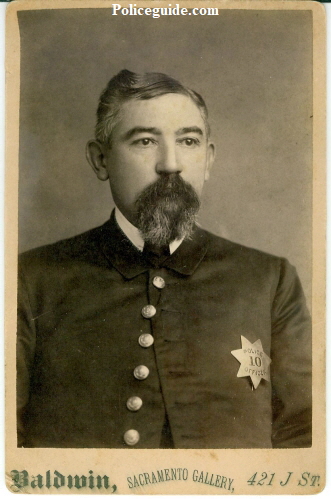 Cabinet photo by Baldwin of Sacramento Police officer William Lowell wearing 1st issue badge number 10.