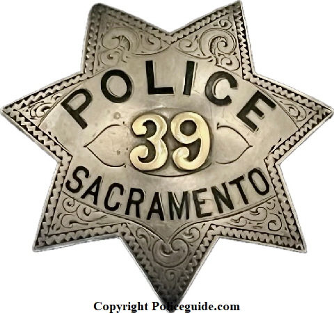 Sacramento Police badge #39, sterling silver with 14k gold applied numbers and hard fired enamel lettering.  On the back of the badge is the name T. W. Pearson and the date